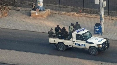 Zambian police reported that a former transport minister was killed during a raid at the residence