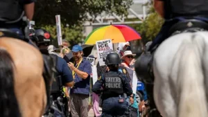 Videos show troops of Dallas Riot Police marching on the streets near and around the convention