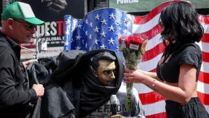 Supporters of slain conservative activist Charlie Kirk and counter-protesters briefly clashed