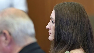 Photos of the Lindsay Clancy holdout juror with his child have surfaced on social media