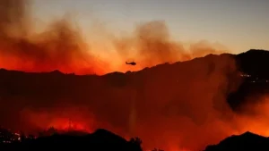 Thousands of California residents faced power outages on Thursday as a fast-growing brush fire