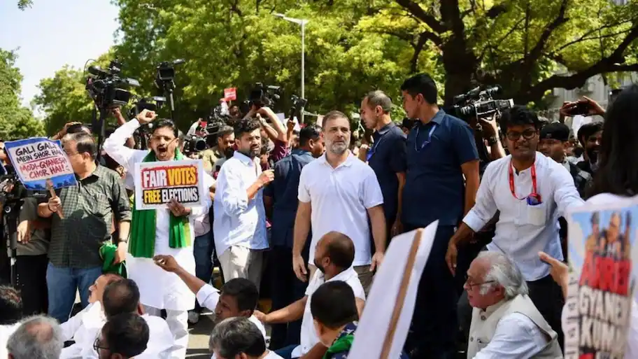 He later climbed onto a police barricade and waved the national flag