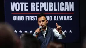 Retired educator Michael Pogue appeared at one of Ramaswamy's campaign gatherings in Cincinnati